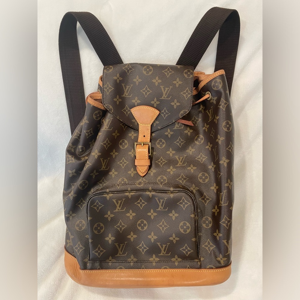 Authentic stamped Louis Vuitton backpack. Clean inside/out, leather is great!